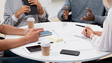 close-up-young-colleagues-having-meeting.jpg